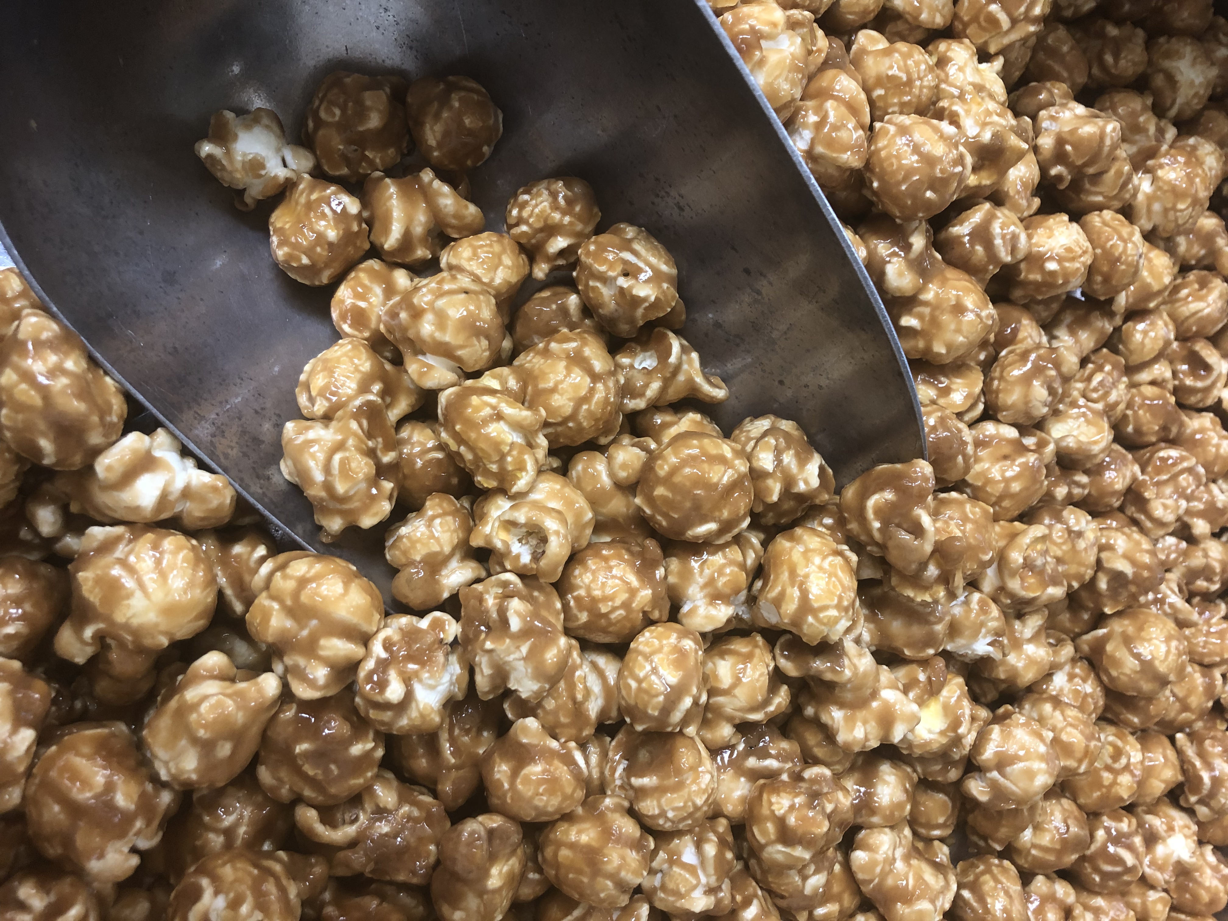 Chicago's best caramel popcorn made with coconut oil, served with a scoop